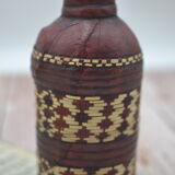 Set of 2 decorative vintage bottles covered with leather & wicker