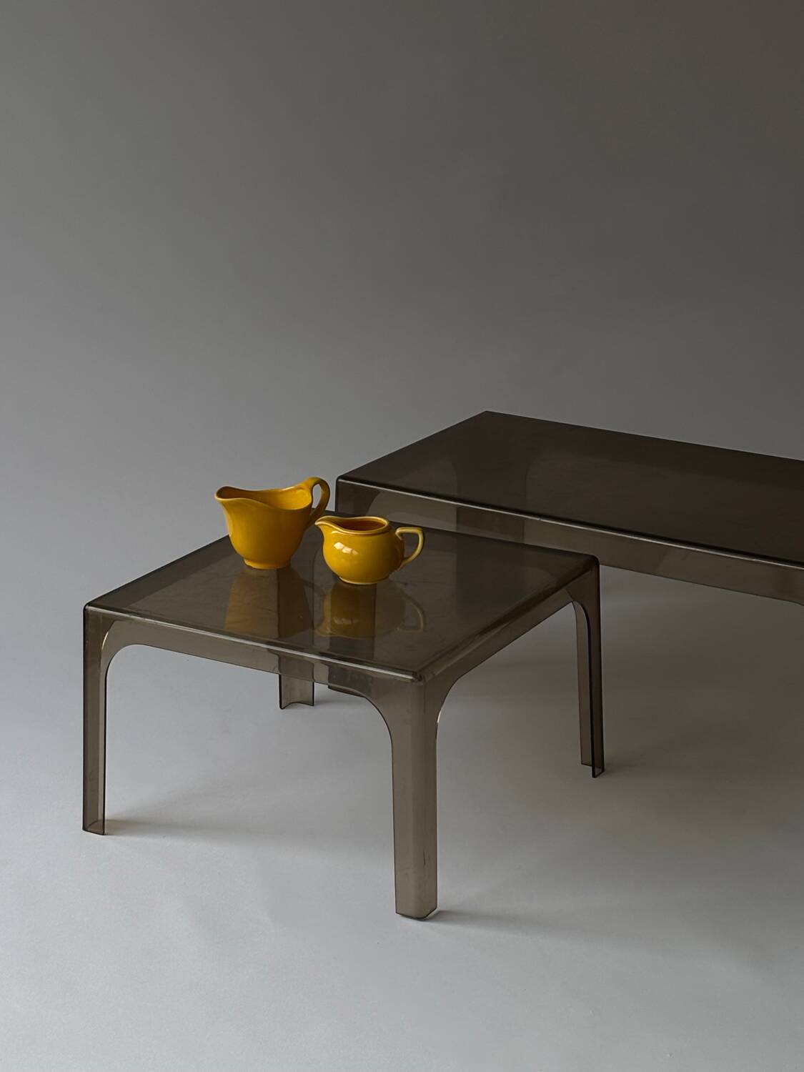Smoked plastic coffee tables 1970