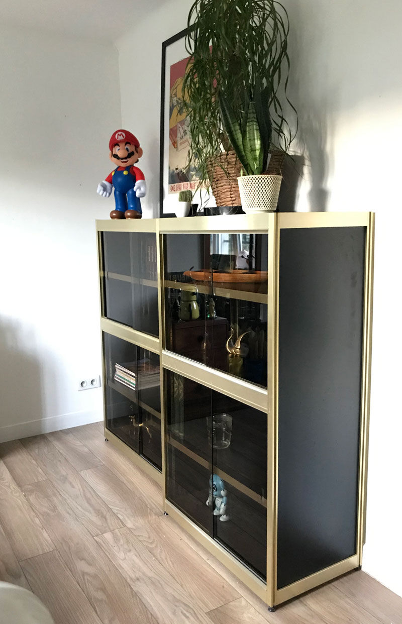 Shelves of black and gold windows