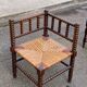 19th-century turned wooden corner chair with rush seating.