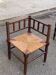 19th-century turned wooden corner chair with rush seating.