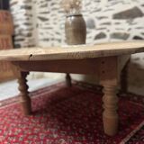 Oval coffee table in raw wood
