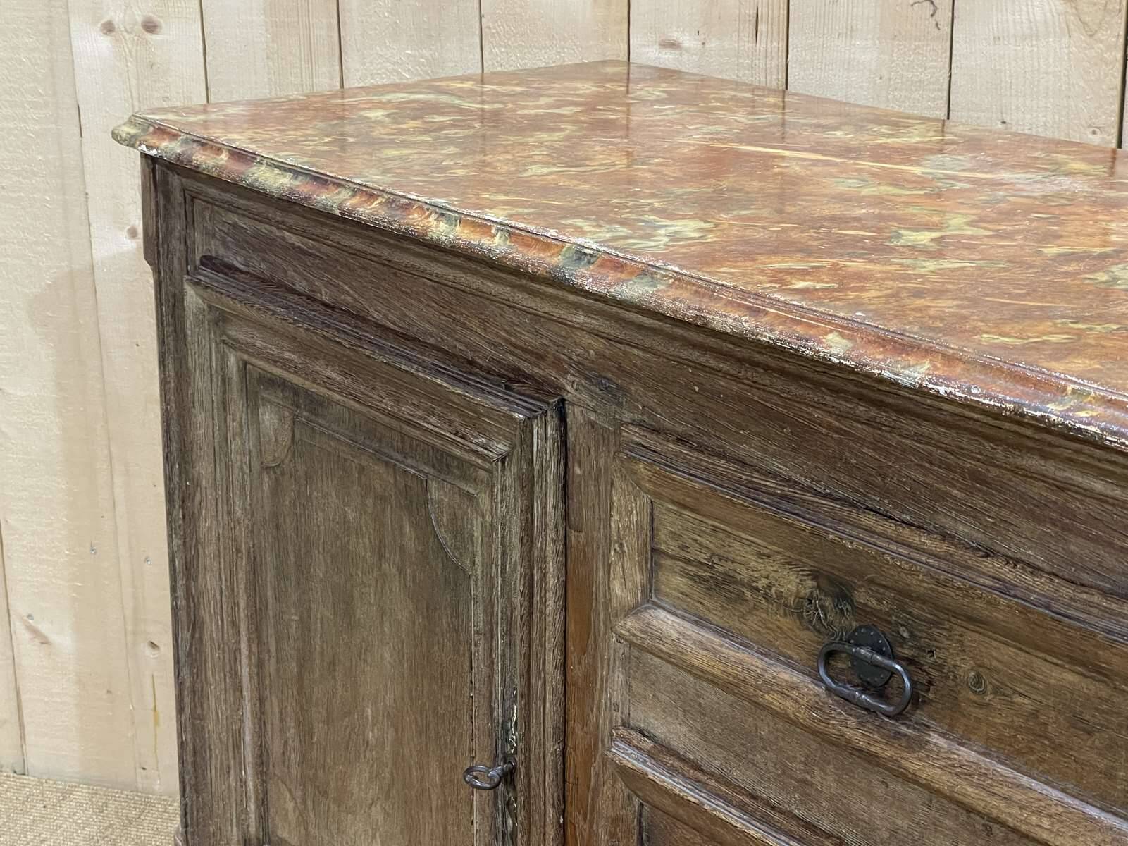 18th-century oak enfilade with a marble-effect painted top.