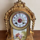 Napoleon III clock in gilded bronze and porcelain plates decorated and painted by hand