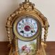 Napoleon III clock in gilded bronze and porcelain plates decorated and painted by hand