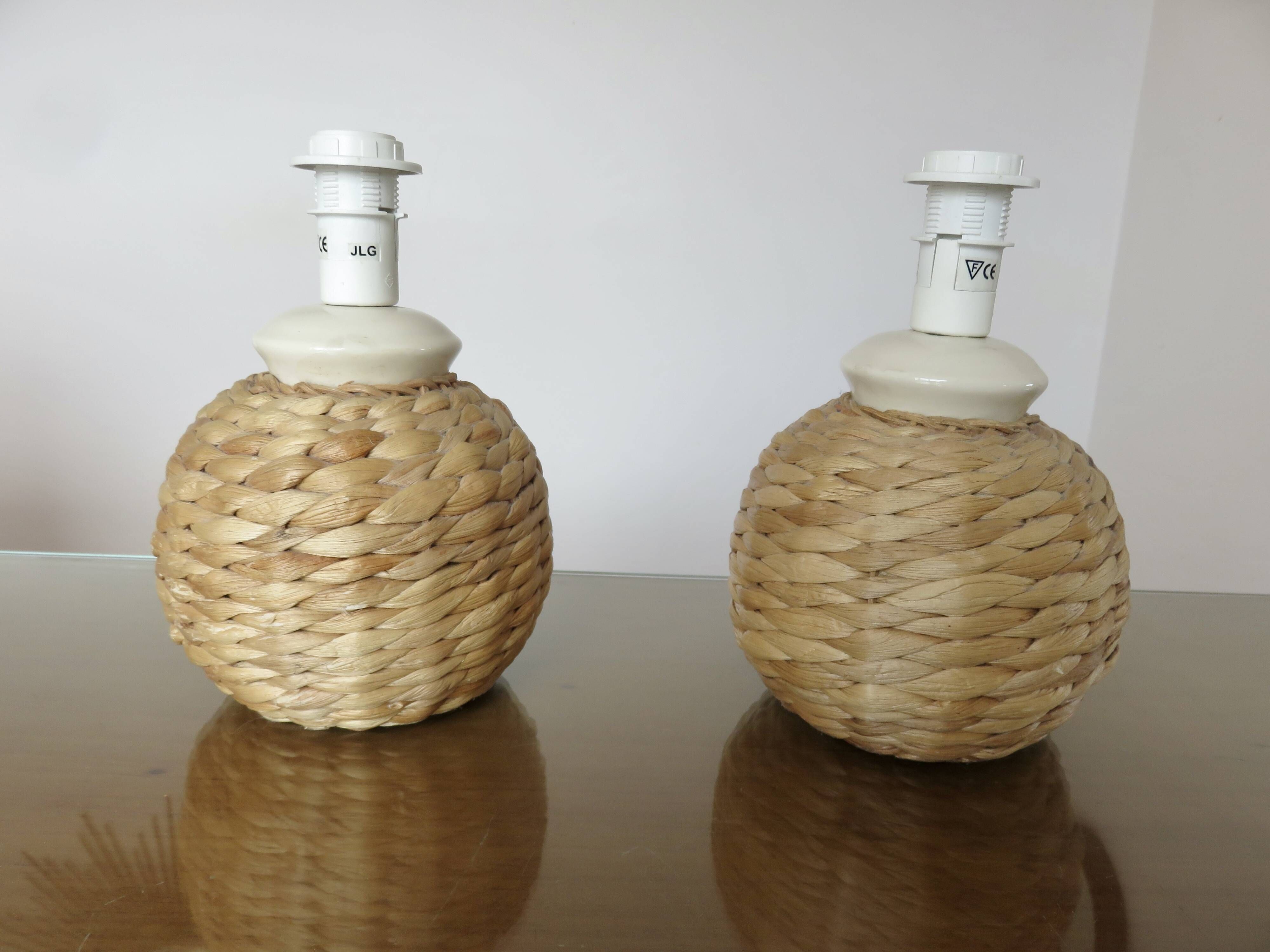 Pair of bedside lamps made of woven sea rush, matching lampshades, 1980.