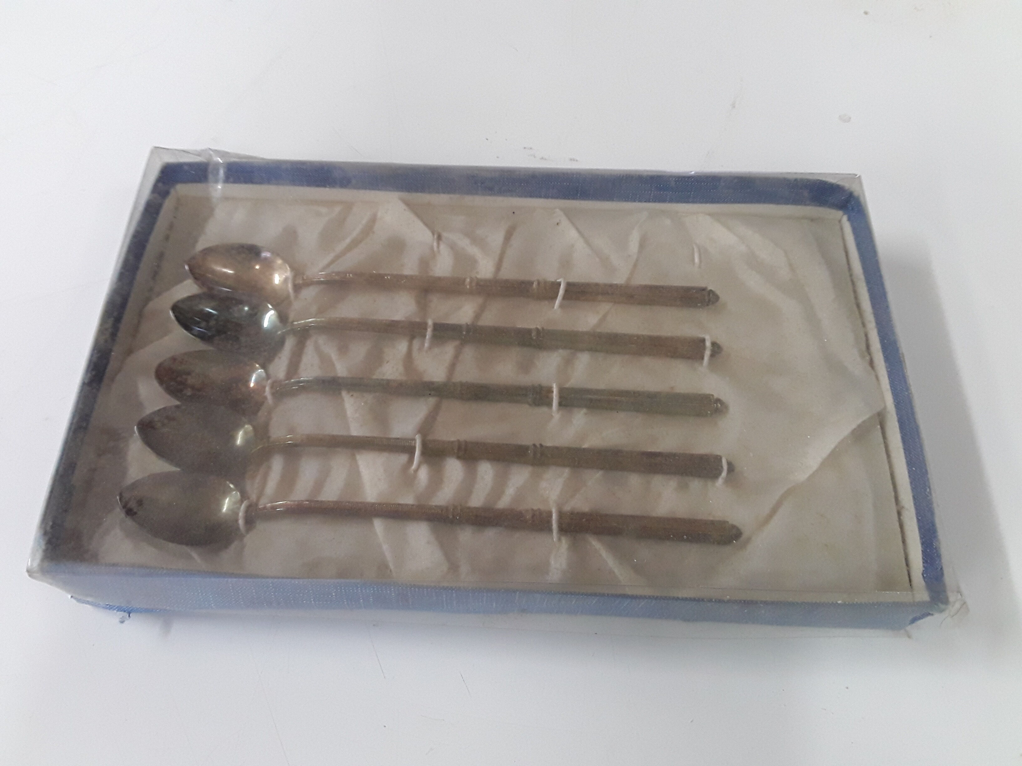 Old box with five spoons