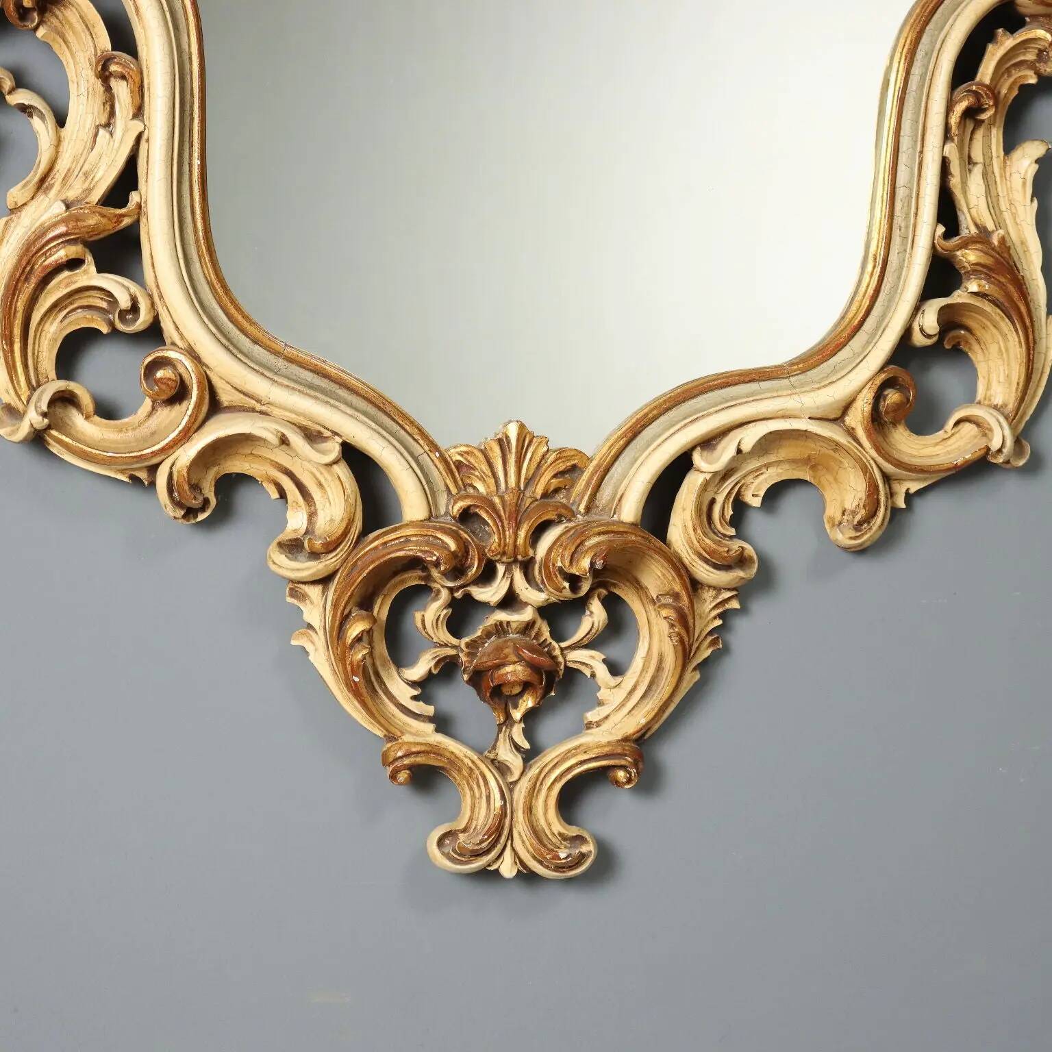 Antique lacquered and gilded wooden mirror, Italy, early 20th century.