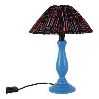 Small old lamp with painted wooden base and hand-sewn printed lampshade