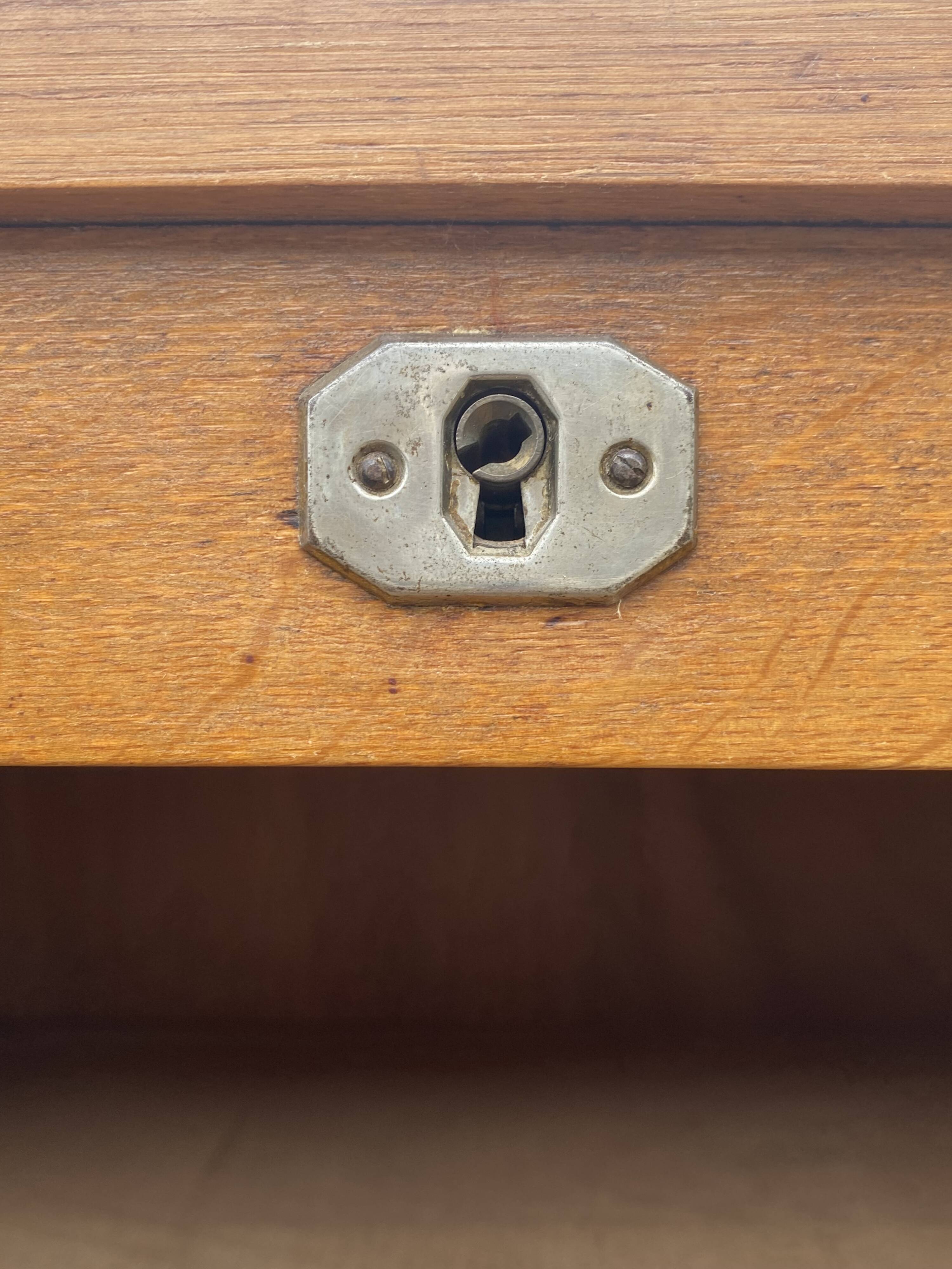 Double-column oak filing cabinet with curtains, 1950s.