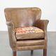 Fauteuil en cuir subtil avec coussin d'assise réversible en kilim