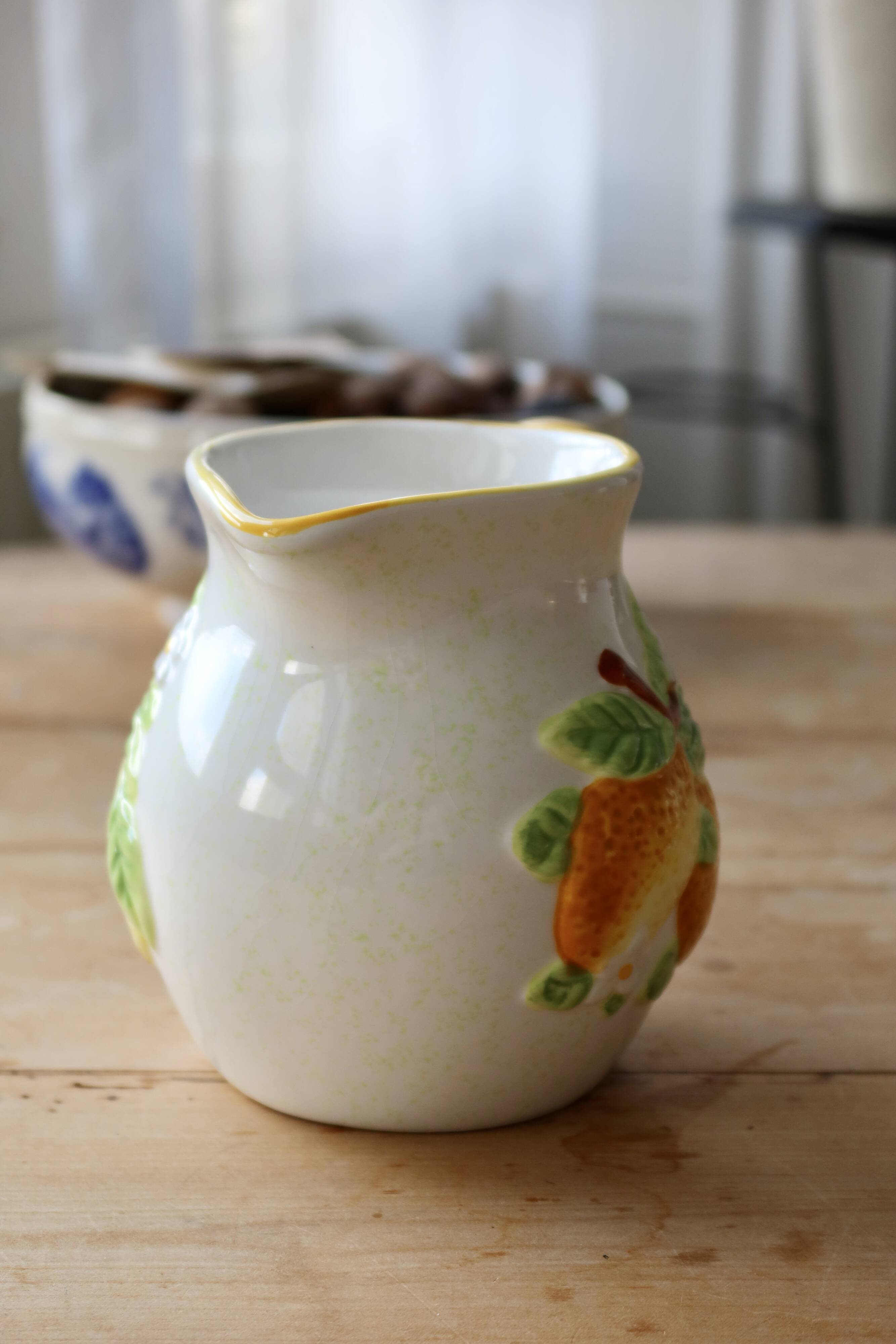 Vintage earthenware and slip pitcher with lemon motif