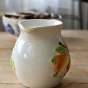 Vintage earthenware and slip pitcher with lemon motif