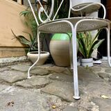 White wrought iron garden armchair