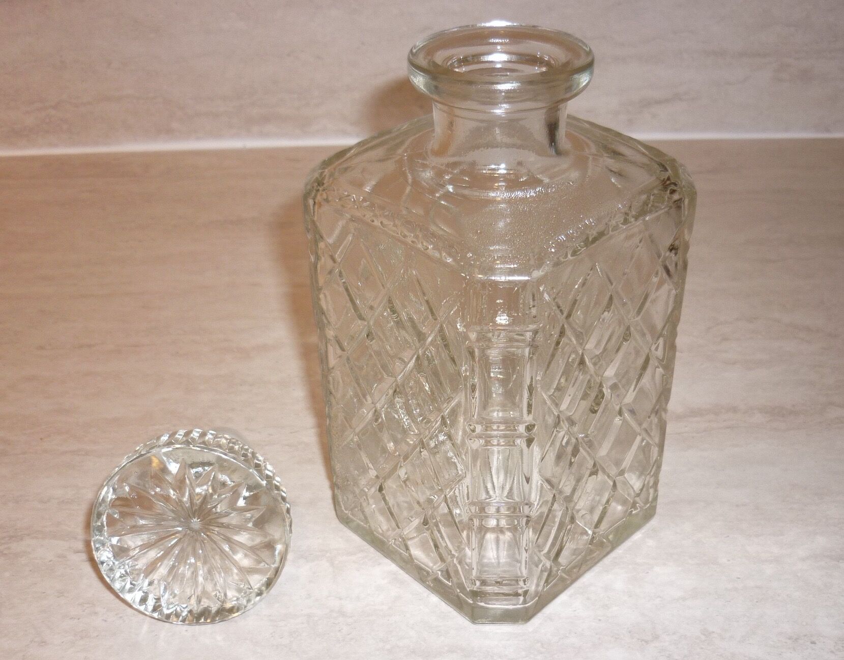 Antique whisky decanter made of chiseled glass