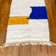 Berber carpet béni ouarain modern white with abstract patterns mustard yellow and blue majorelle