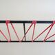 Minimalist wall coat rack in string design in black and red