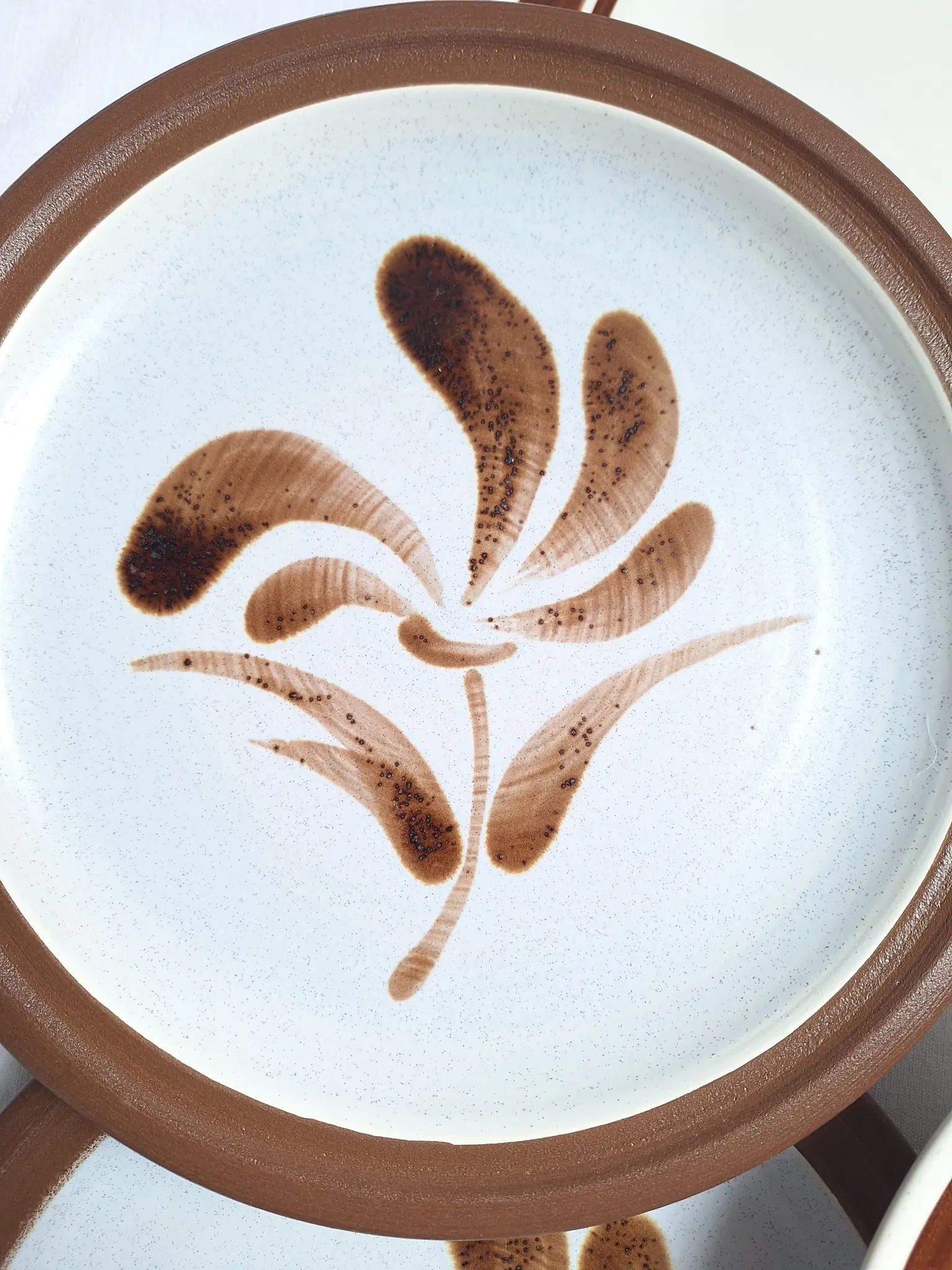 Brown flower-patterned plates from the 1970s.