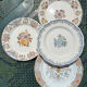 Composition of 4 flat earthenware plates, Gien