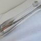 Christofle Silver-plated metal sugar tongs with crossed ribbon bow design