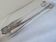 Christofle Silver-plated metal sugar tongs with crossed ribbon bow design