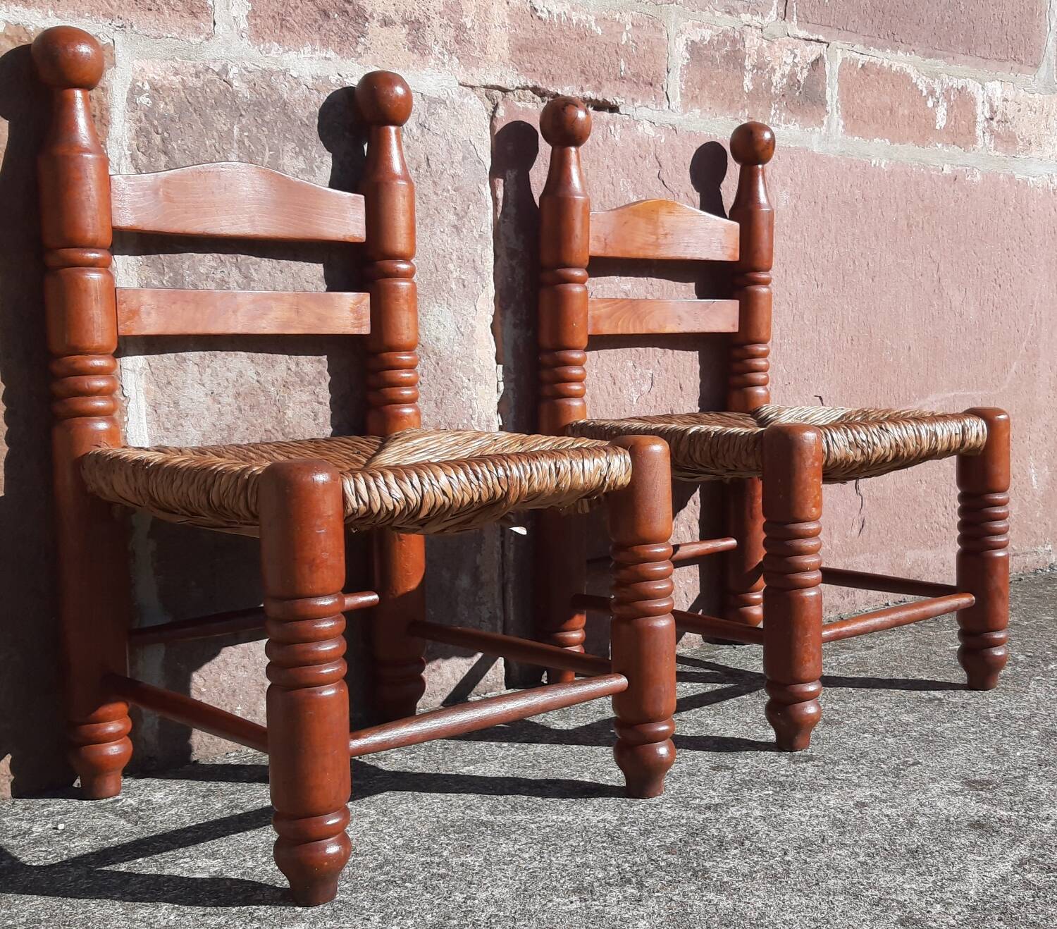 Pair of low armchairs by the fireplace. (Straw seat)