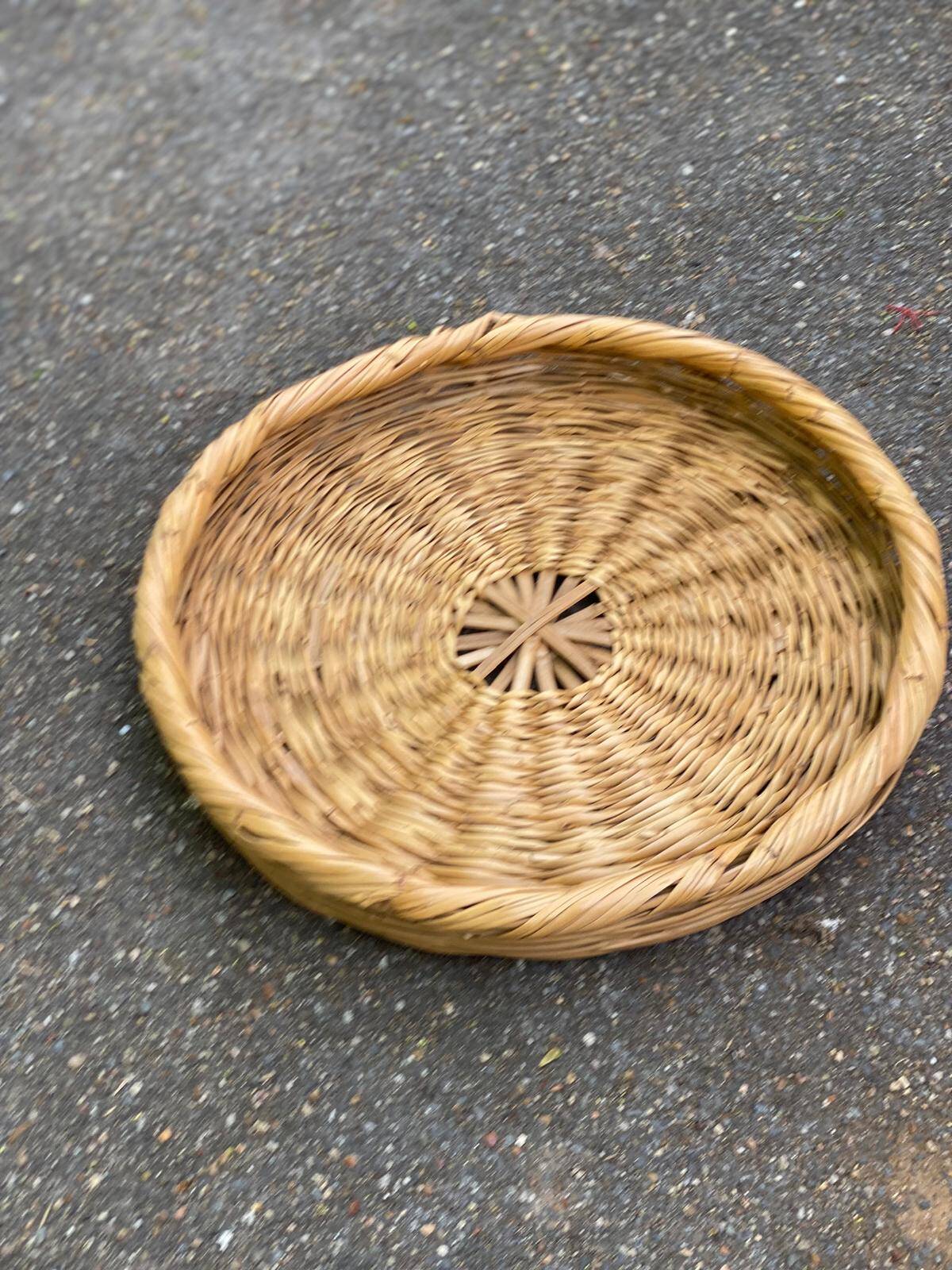 Round basket woven from straw