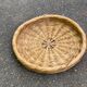 Round basket woven from straw