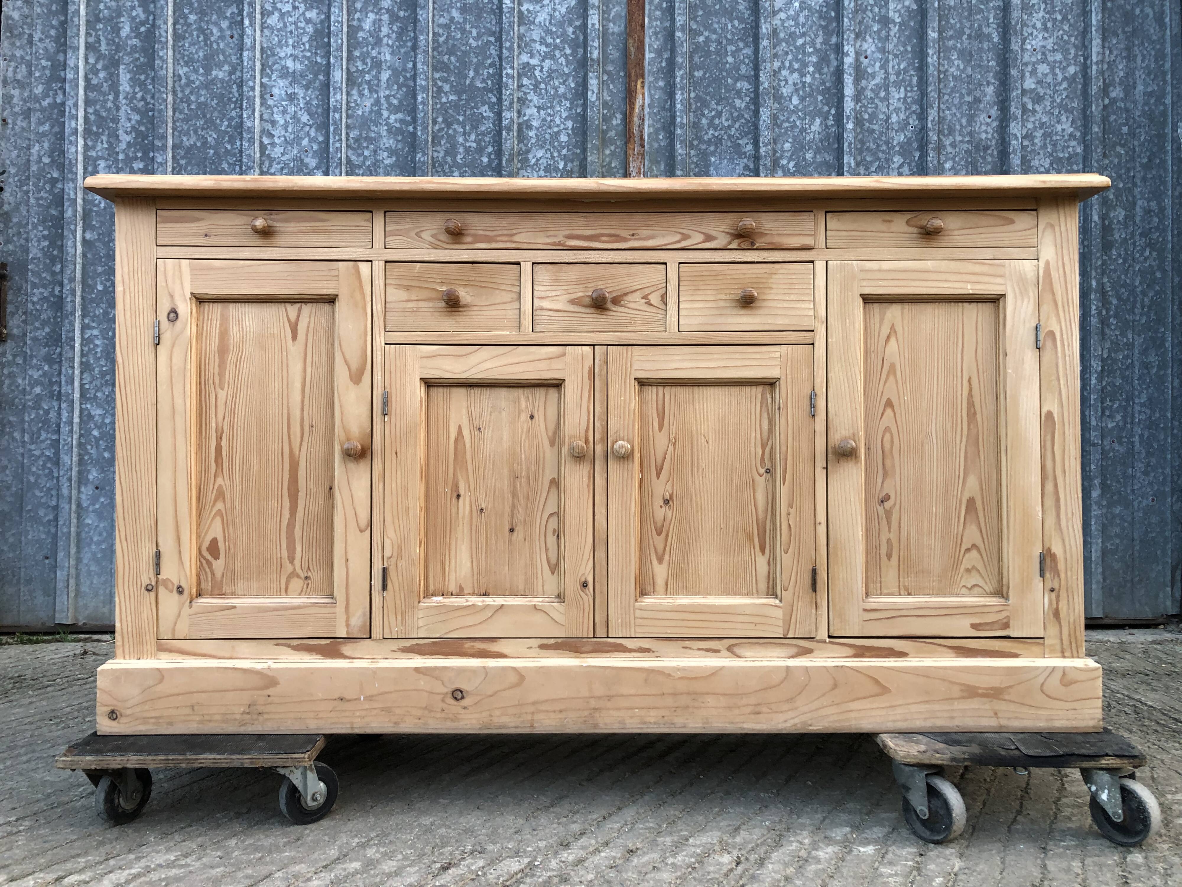 Scandinavian natural pine sideboard with 4 doors and 6 drawers.