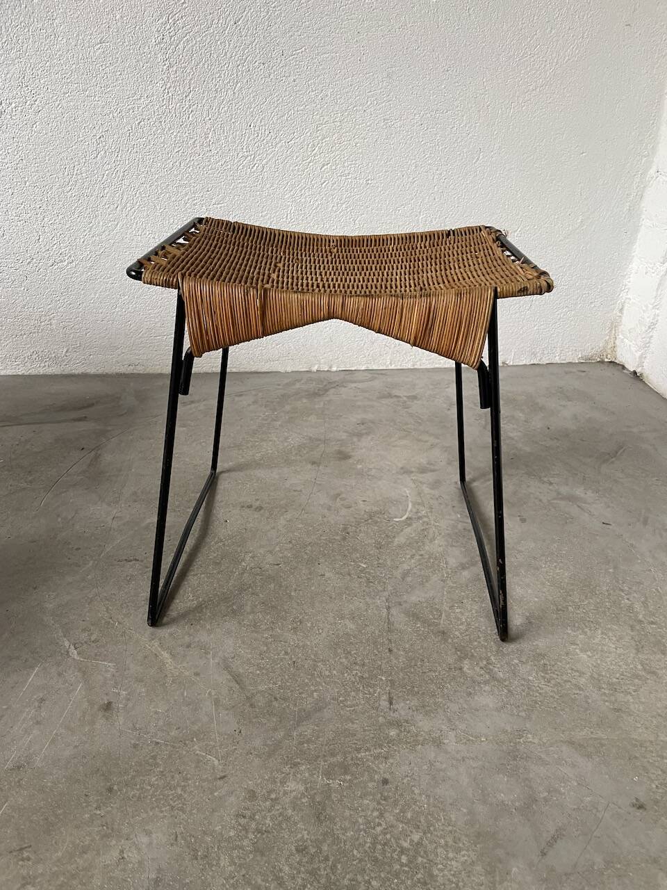 Set of three Raoul Guys wicker and metal stools