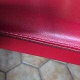 Red leather dining chairs by Arper