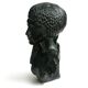 Woman bust in carved stone, 50s