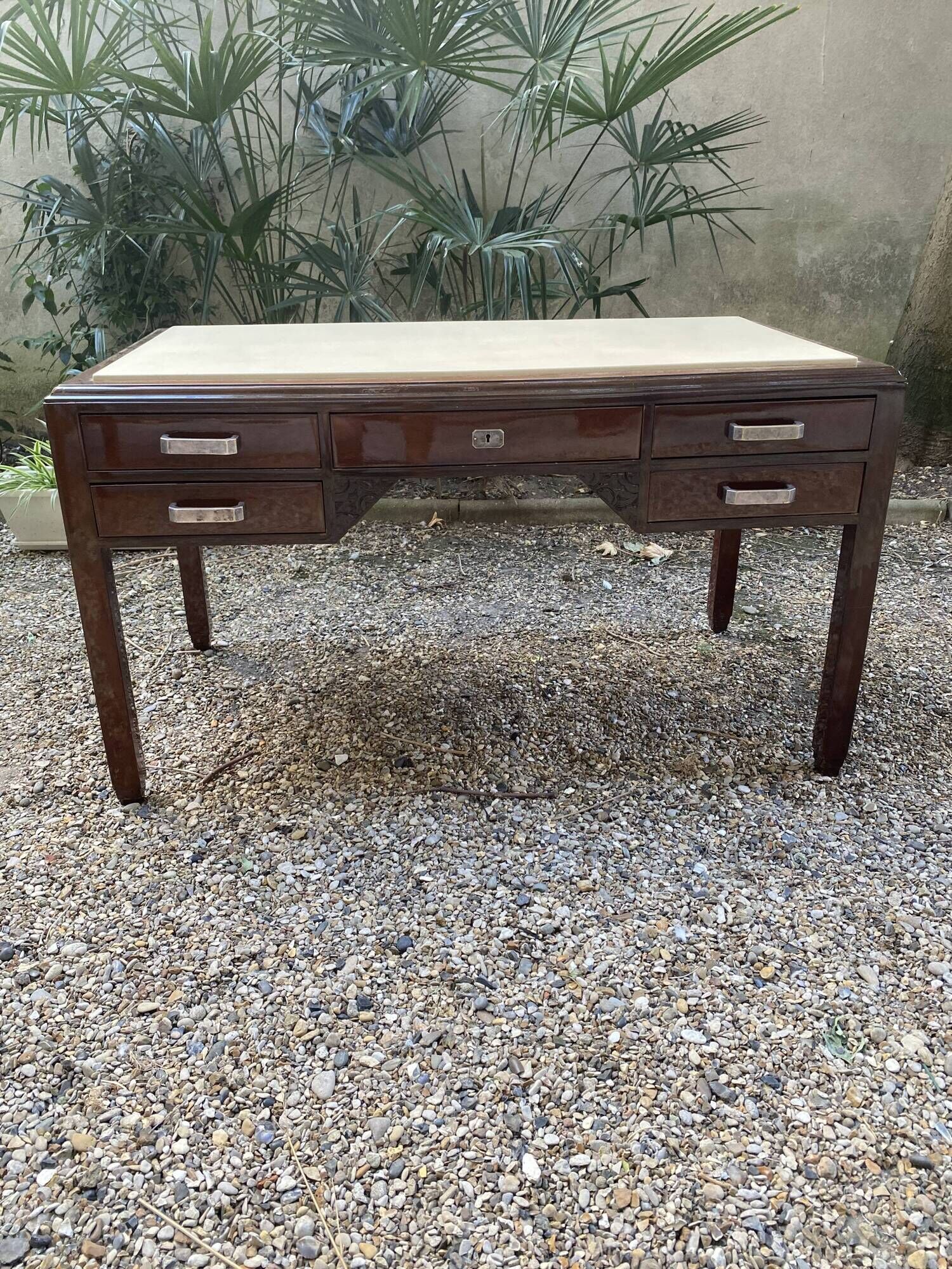 Art Deco desk in varnished mahogany.