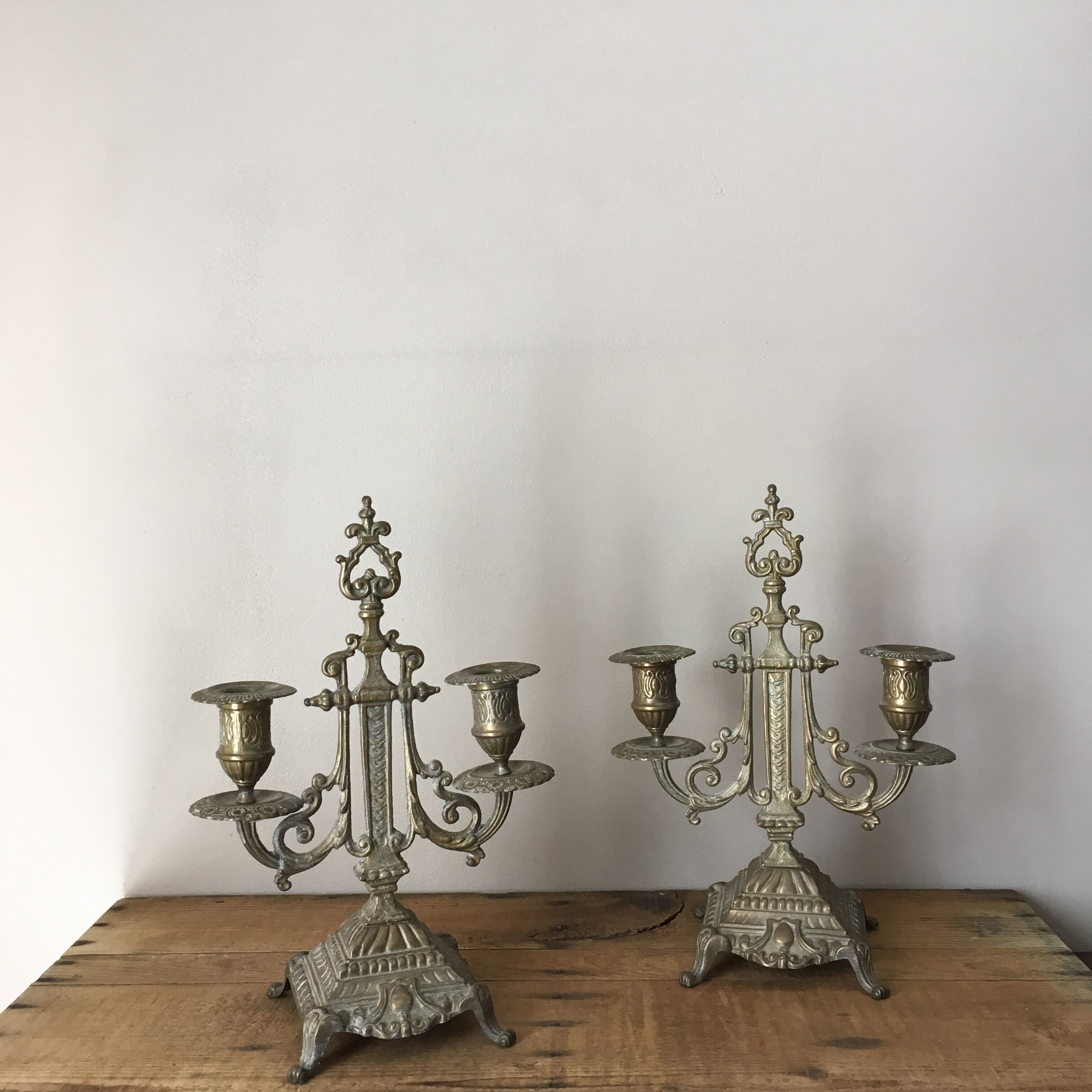 2 gold metal candlesticks