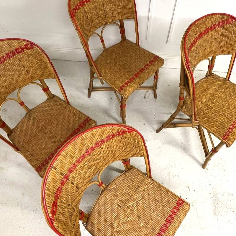 Set of 4 antique chairs in woven red and natural rattan.