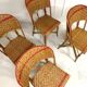 Set of 4 antique chairs in woven red and natural rattan.