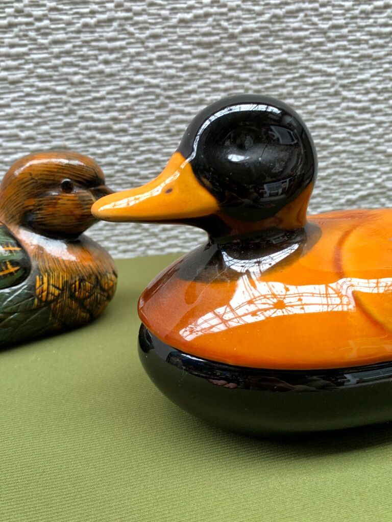Enamelled terracotta boxes in the shape of ducks.