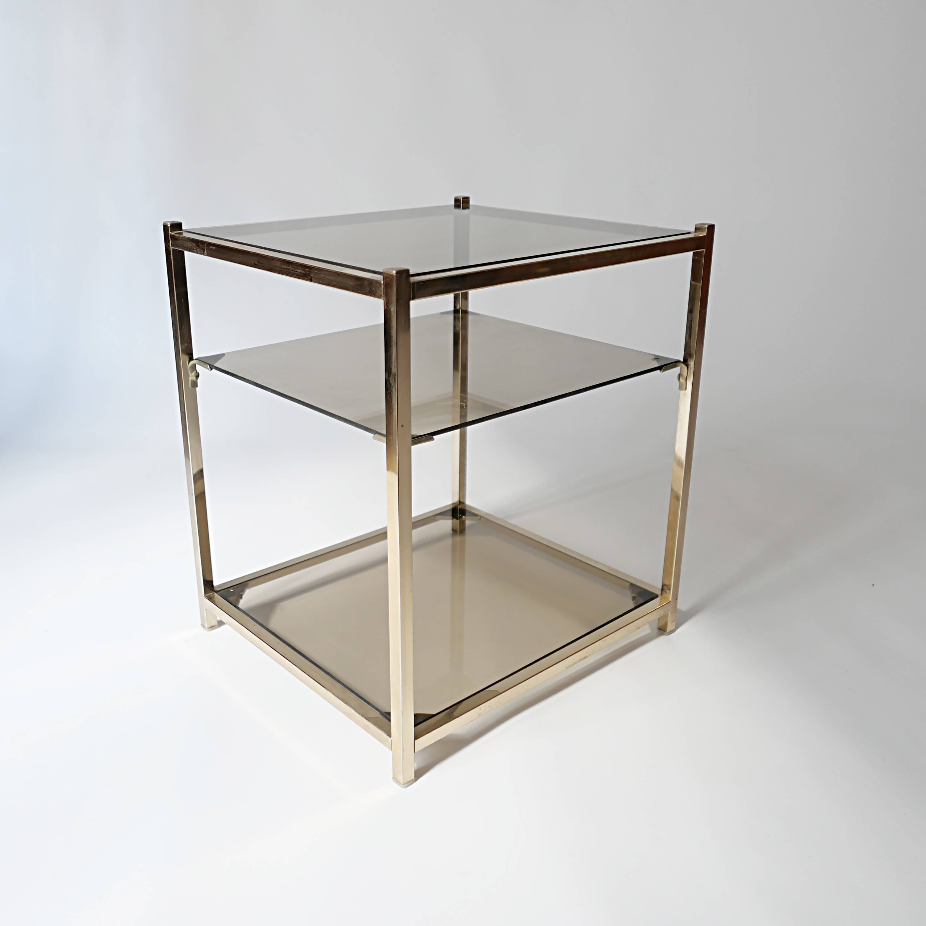 vintage coffee table design 1960s 1970s in gold metal and smoked glass