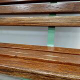Restored and varnished garden bench in hardwood and olive green metal