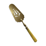 Pie server cake dessert in gold metal vintage silverware yellow bakelite handle