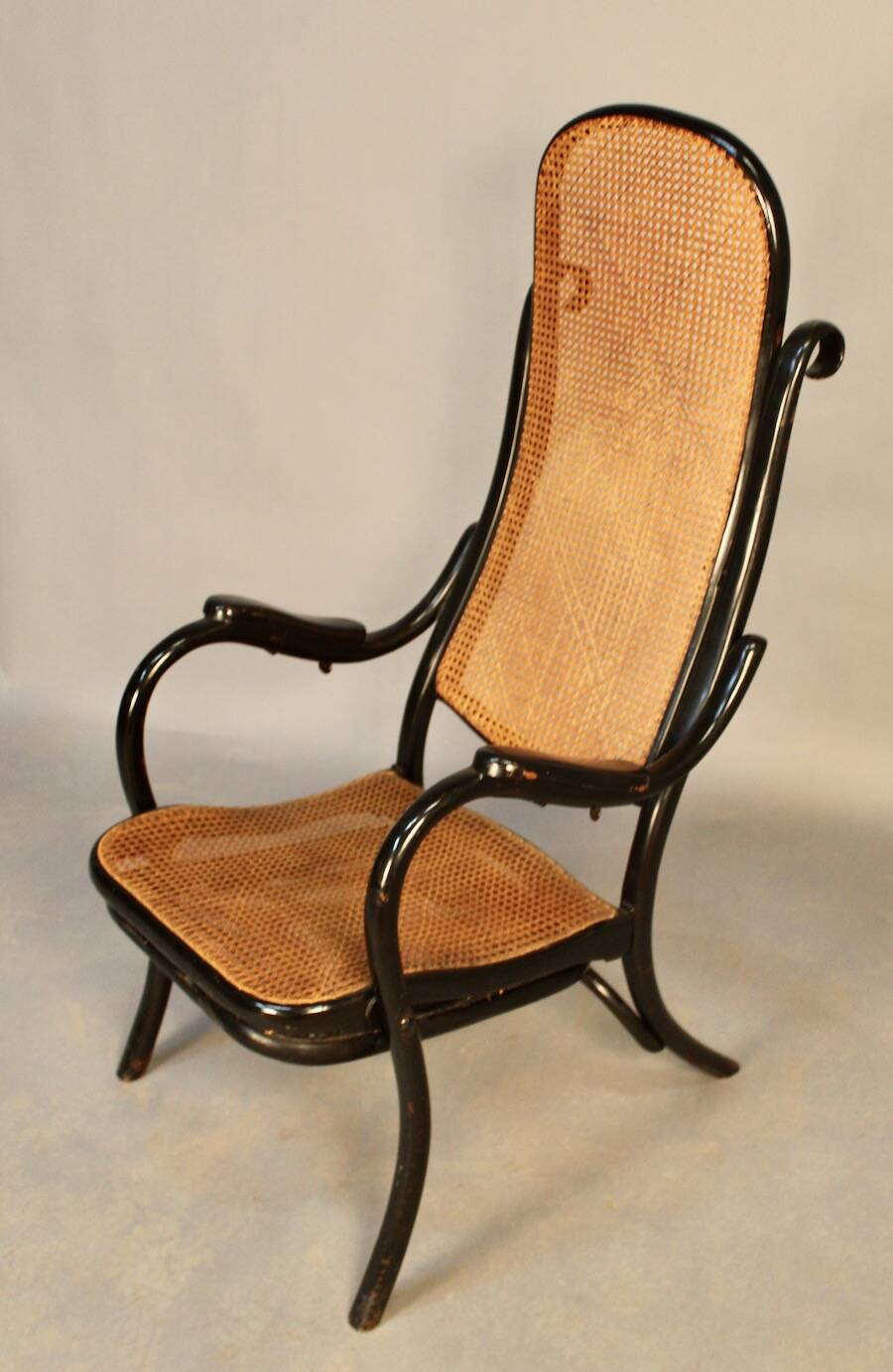 Bentwood cane armchair with mechanism and footrest