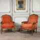 Pair of transitional carved wooden armchairs, 18th century