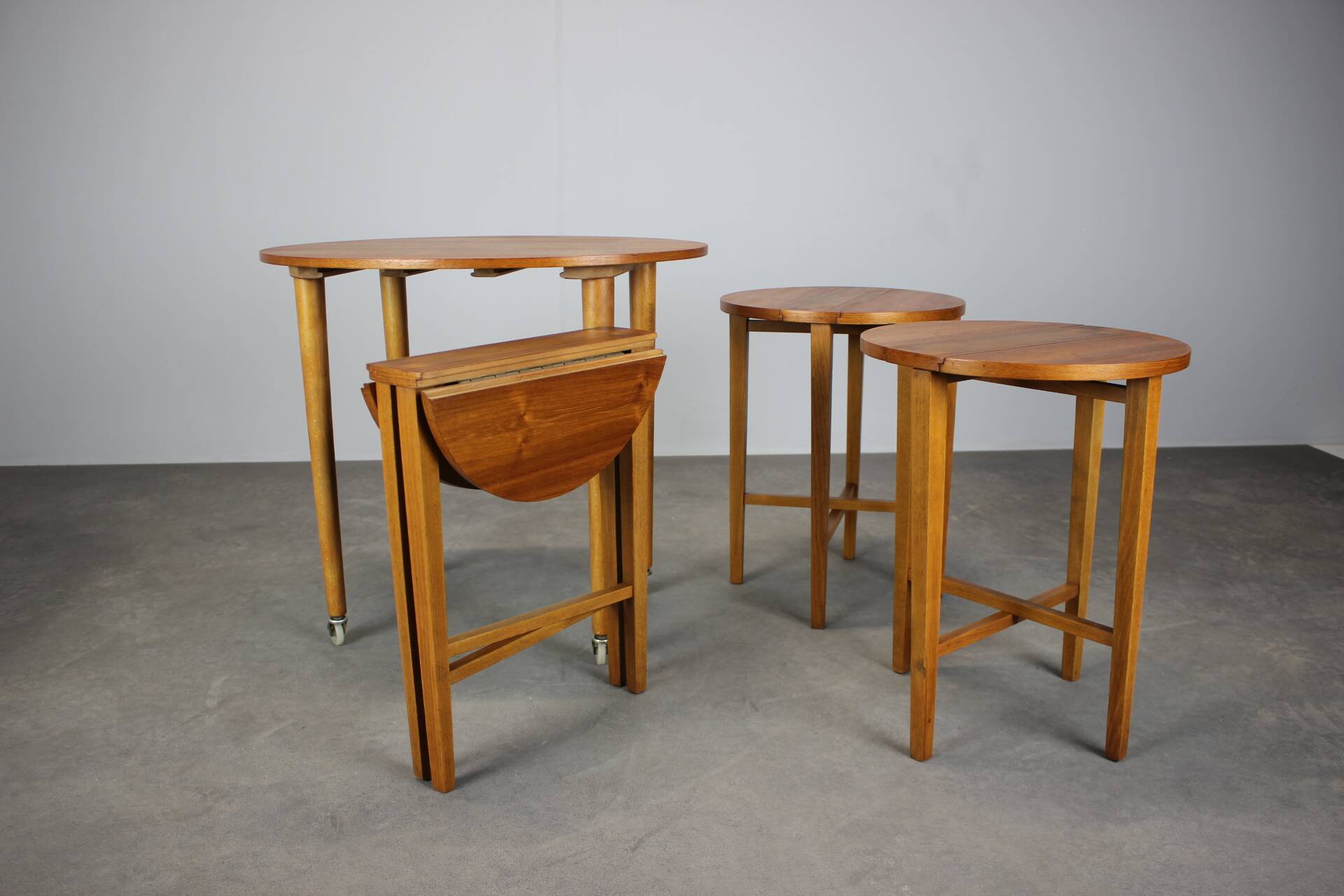 Restored Danish folding teak table with three nesting chairs by Poul Hundevad