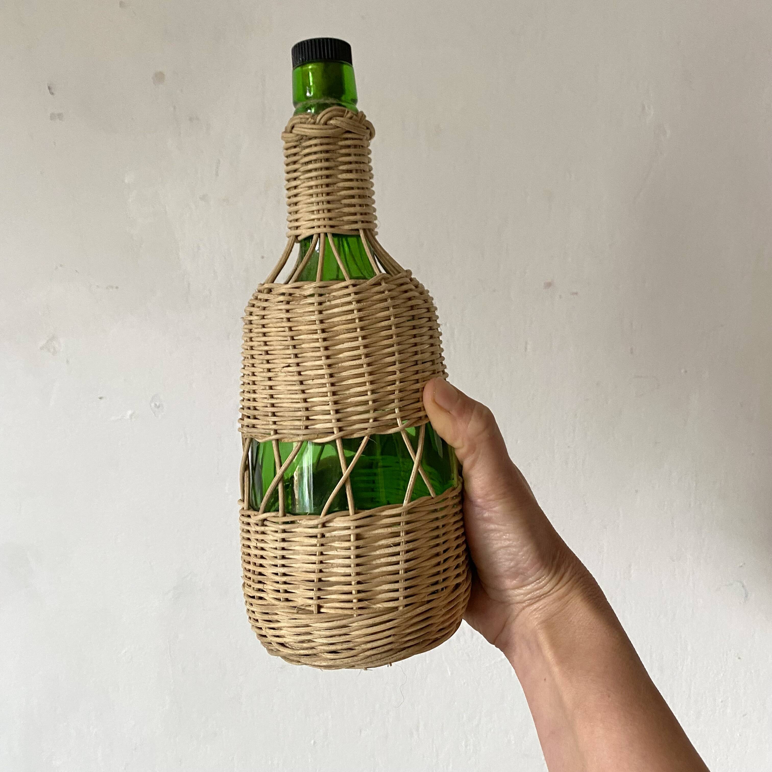 Glass bottles and woven rattan