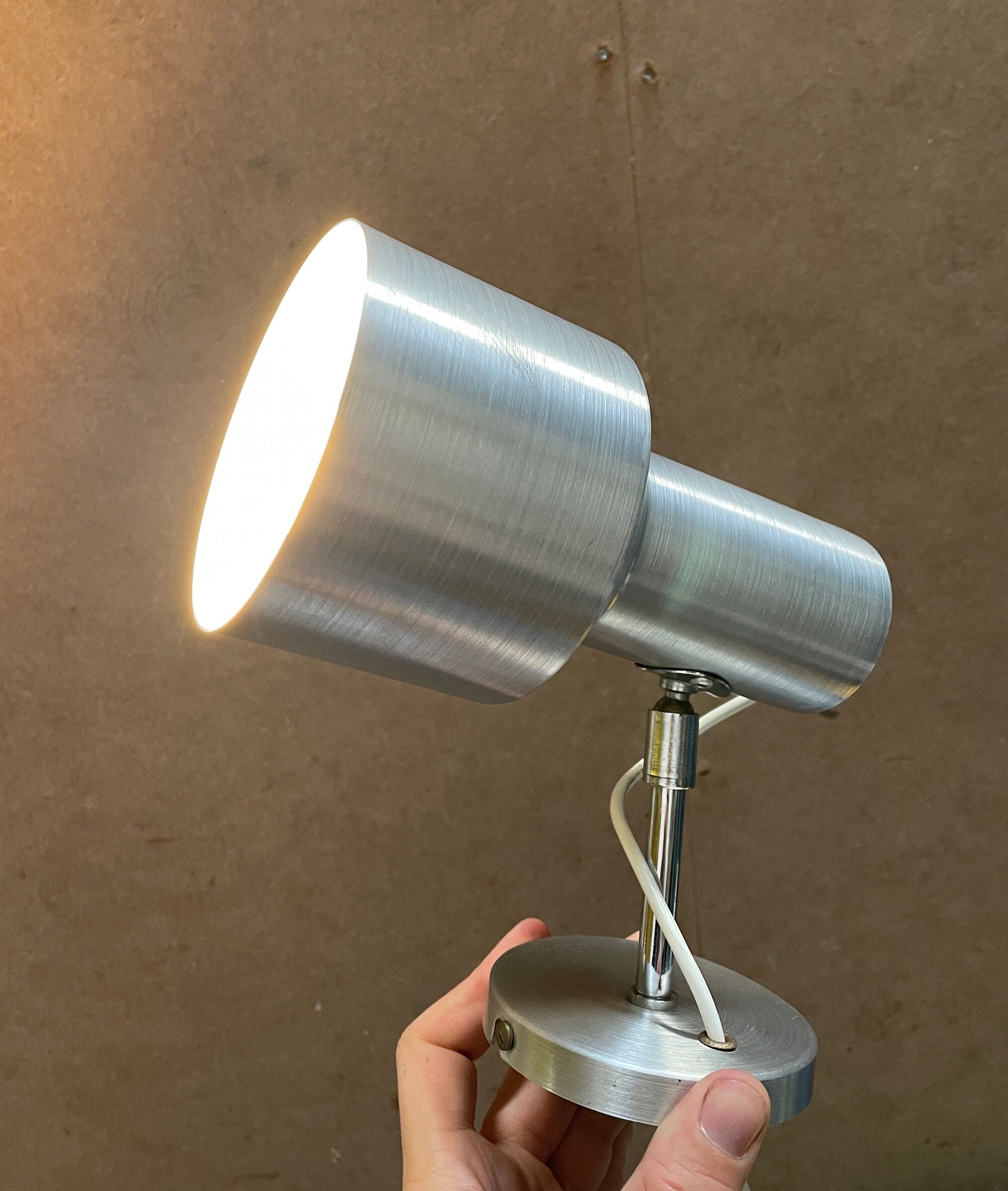 Pair of swivel brushed metal sconces