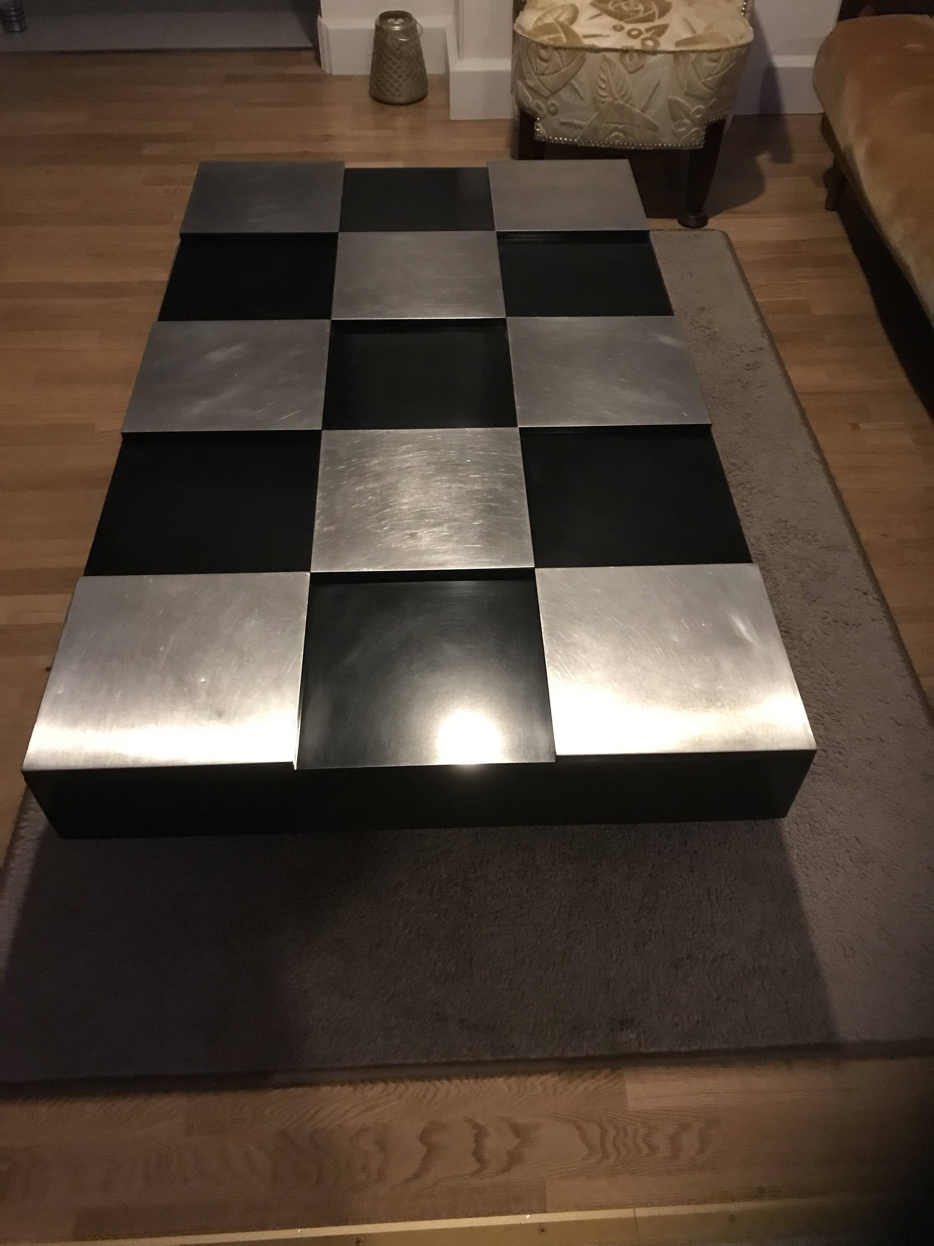 Coffee table with stainless steel checkered top and black formica