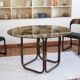 Round dining table in rattan, smoked glass top, 1970s.