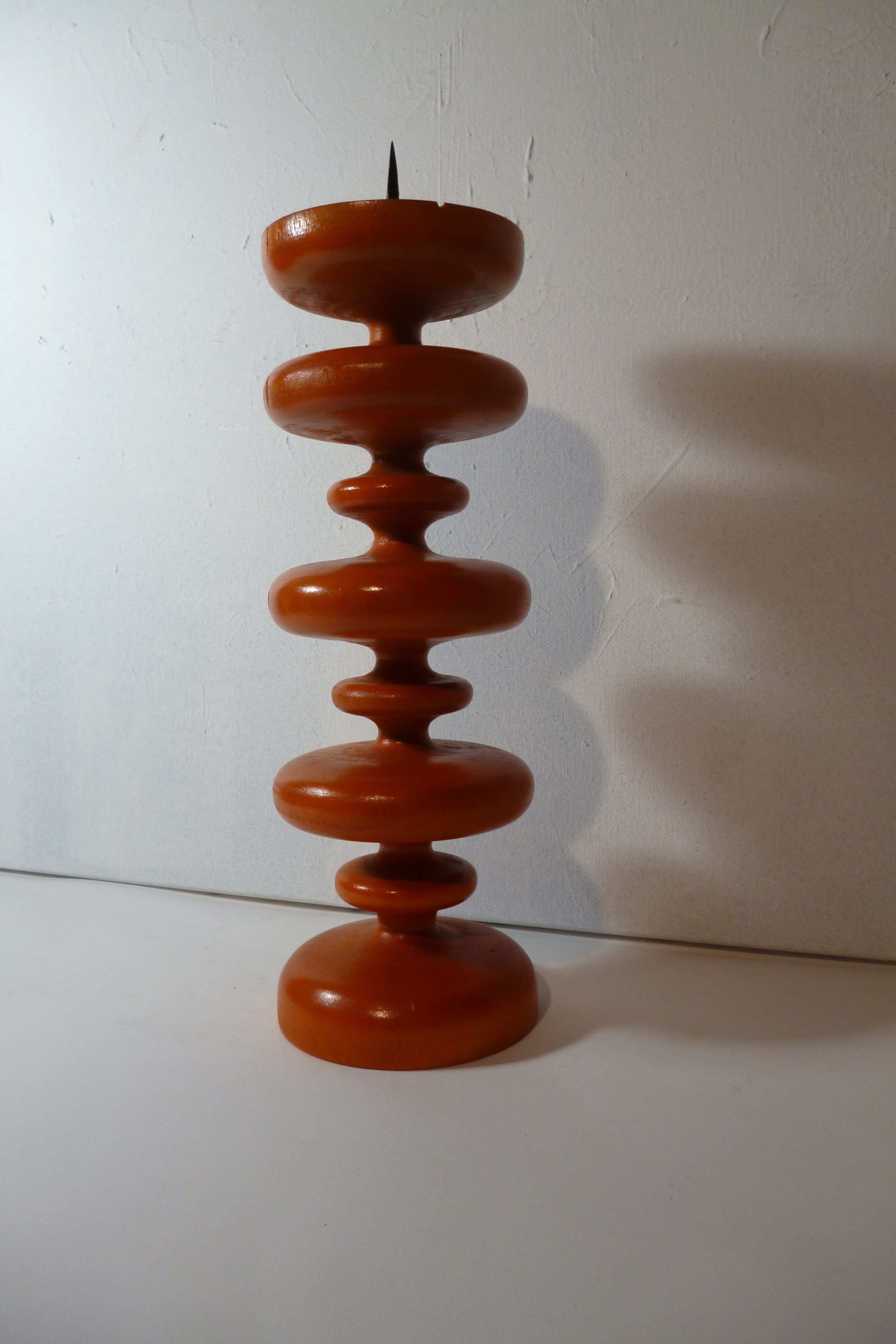 Vintage wooden candlestick turned orange