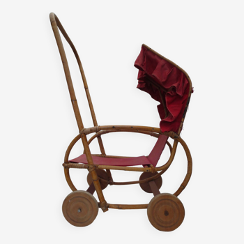 Very old doll's stroller, made of wood and wicker