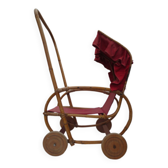 Very old doll's stroller, made of wood and wicker